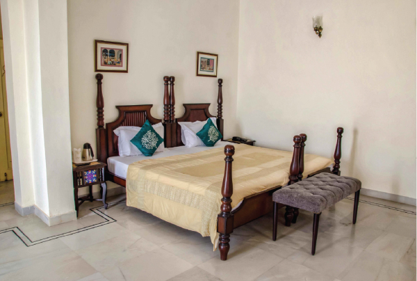 A side view of a plate of figs and berries.