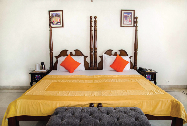 A side view of a plate of figs and berries.