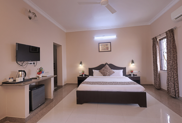 A side view of a plate of figs and berries.