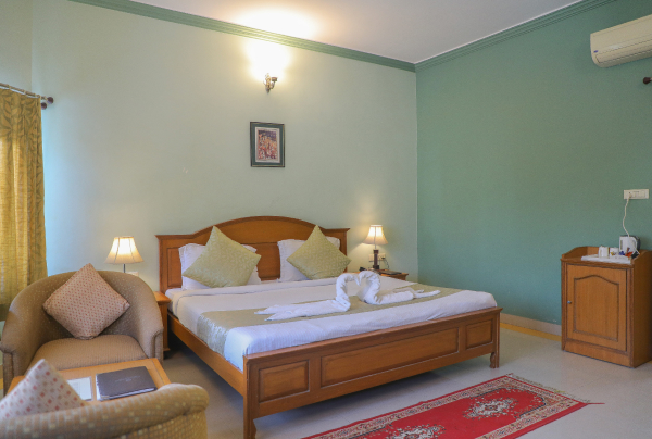 A side view of a plate of figs and berries.